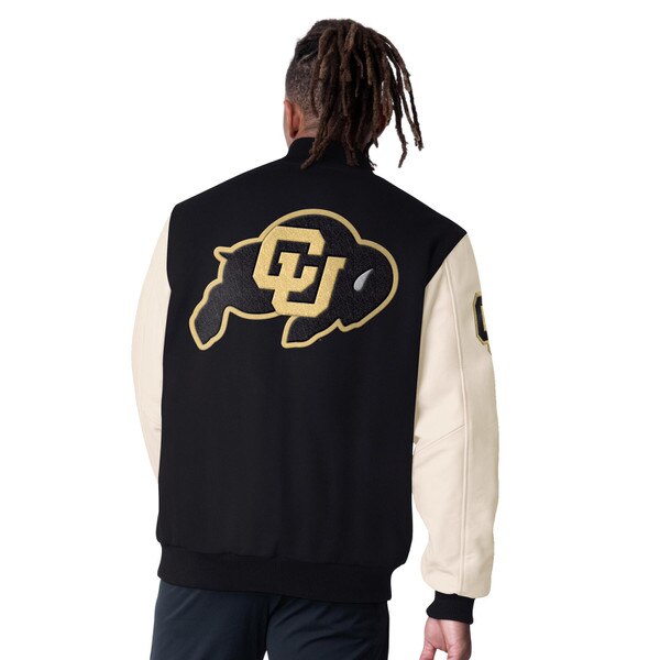The back view of a person wearing a black varsity jacket with cream leather sleeves. The jacket features a large embroidered CU Buffalo logo on the back in gold and black.